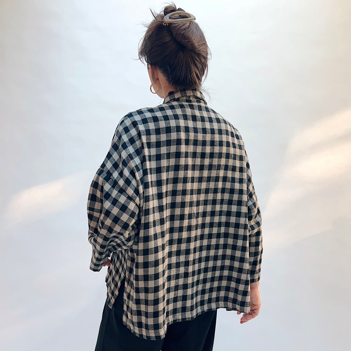 Eleven Stitch Big Check Big Shirt in Fennel, back view showing the oversized silhouette and mustard contrast side vents in large fennel gingham check cotton flannel