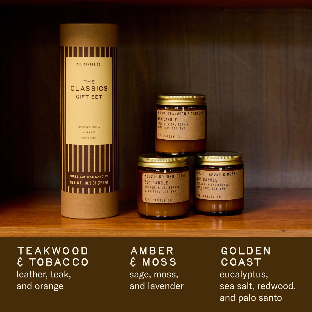 The Classics candle gift set on a wooden shelf. Scent notes: Teakwood & Tobacco, leather, teak, orange; Amber & Moss, sage, moss, lavender; Golden Coast, eucalyptus, sea salt, redwood, palo santo.