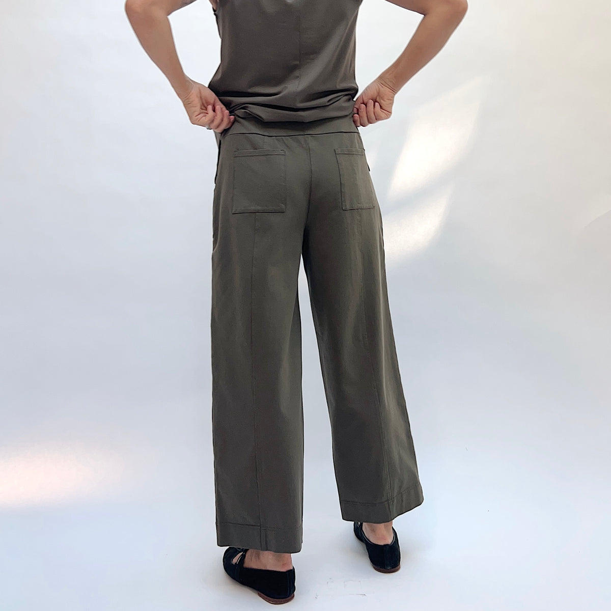 Habitat Stonewash Knit Pocket Flood Pant in Umber, back view showing the patch pockets and wide-leg flood silhouette in umber