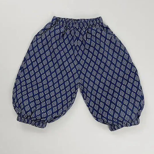 Blue patterned baby bloomers on a light gray background with 'comfort' text.