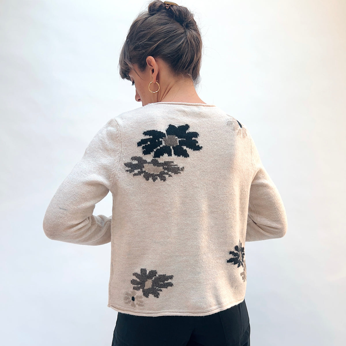 Habitat Cozy Bouquet Sweater in Dove Floral, back view showing the scattered intarsia bouquet motifs and slightly cropped boxy silhouette