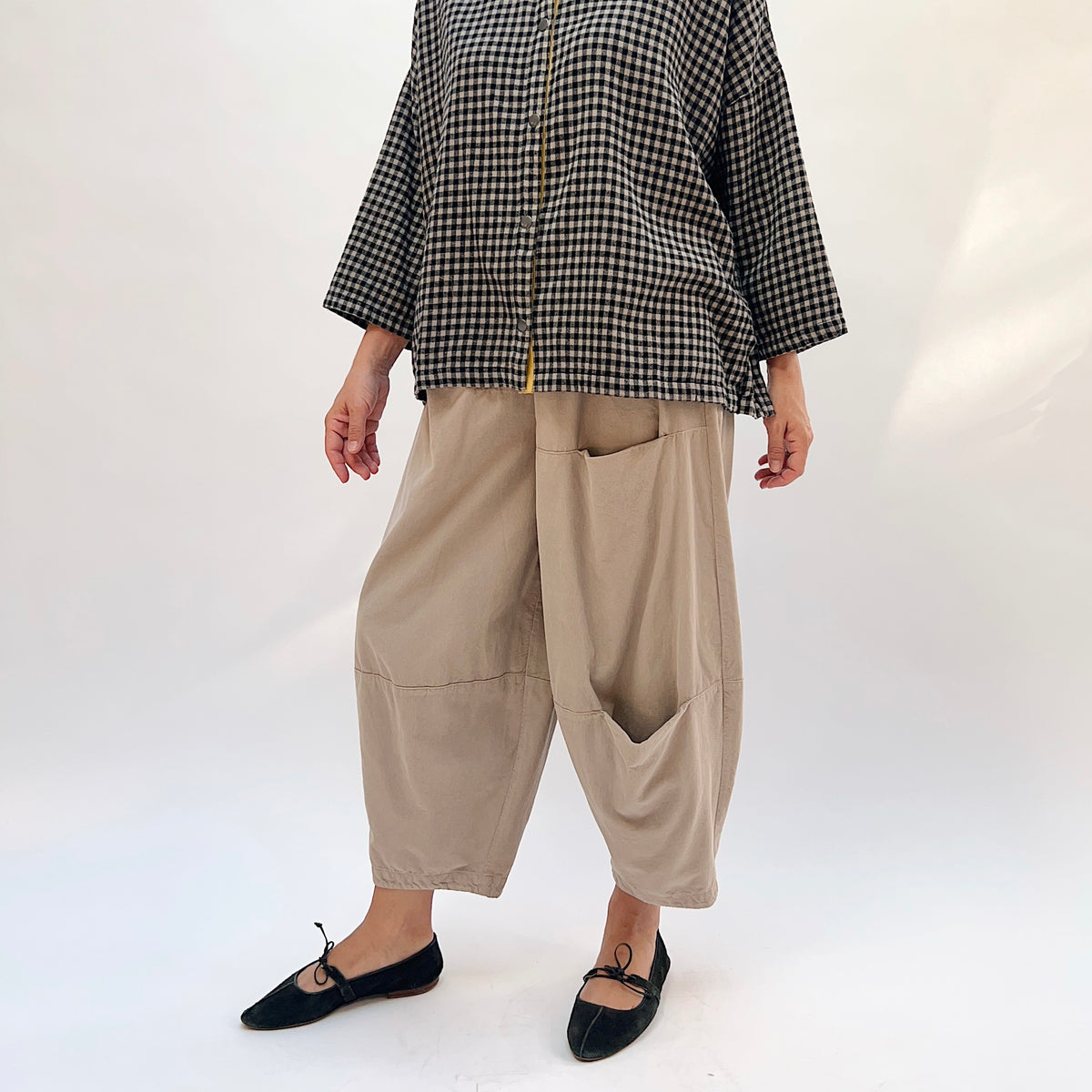 Eleven Stitch Corduroy Three Pocket Pant in Fennel, full front view showing the relaxed balloon leg silhouette and three patch pockets in warm sand cotton corduroy