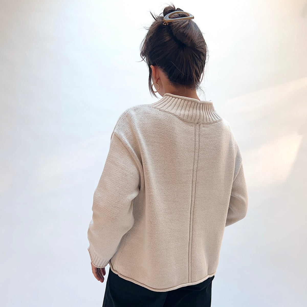 Habitat Fireside Cabin Sweater in Dove, back view showing the center back stitch detail and rolled hem in dove gray