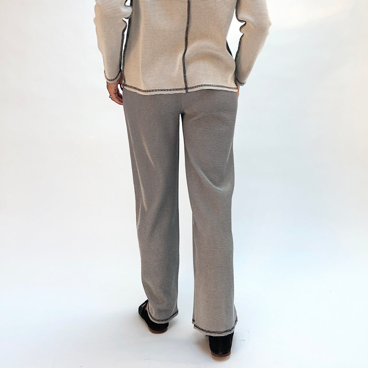 Habitat Opposites Attract Pant in Winter White, back view showing the relaxed wide-leg fit and cropped hem in fine stripe thermal knit