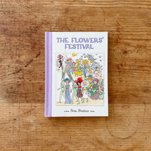 Load image into Gallery viewer, Front cover of Elsa Beskow's The Flowers' Festival that is bound in lavender colored fabric. The illustration shows a parade of people dressed as colorful flowers and grasses.