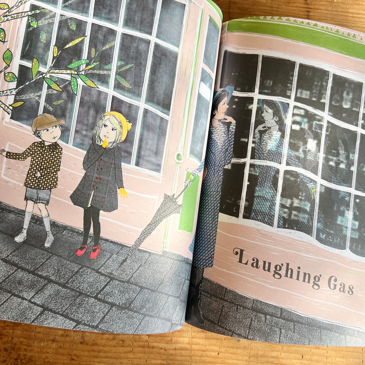 Open pages of Mary Poppins showing Lauren Child’s collage-style illustration of two children and Mary beside large windows, opening the chapter “Laughing Gas.”
