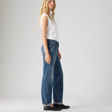 Load image into Gallery viewer, Woman wearing blue jeans and a white top on a plain background