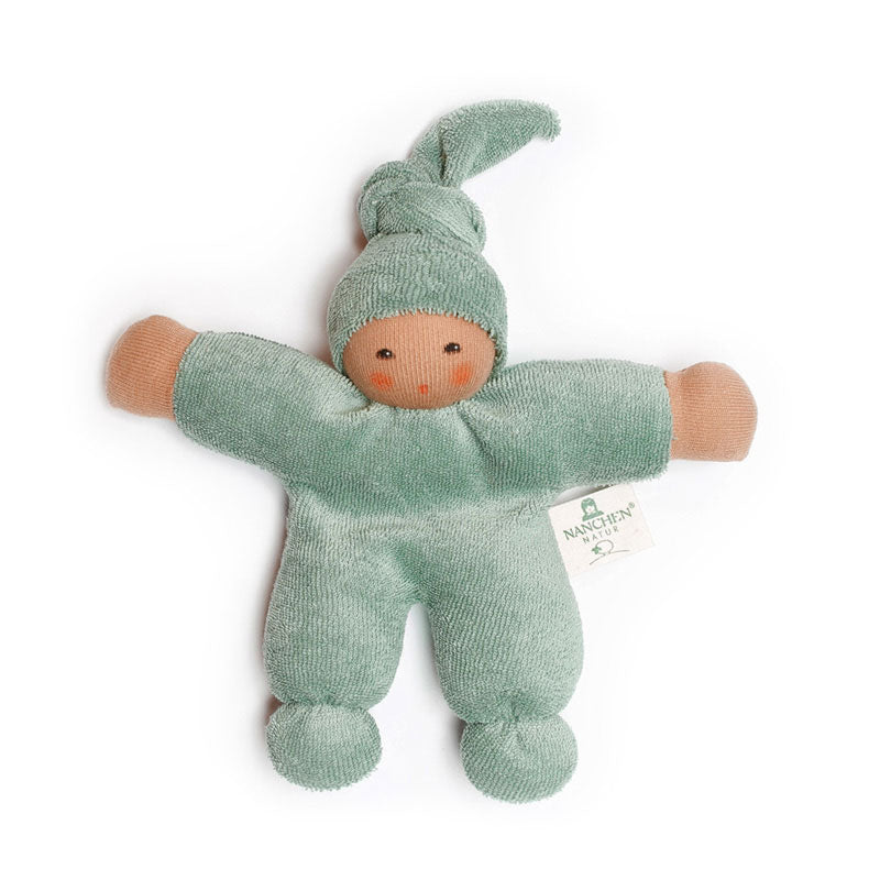 An organic terry baby doll in sage green with a cap, made by Nanchen.