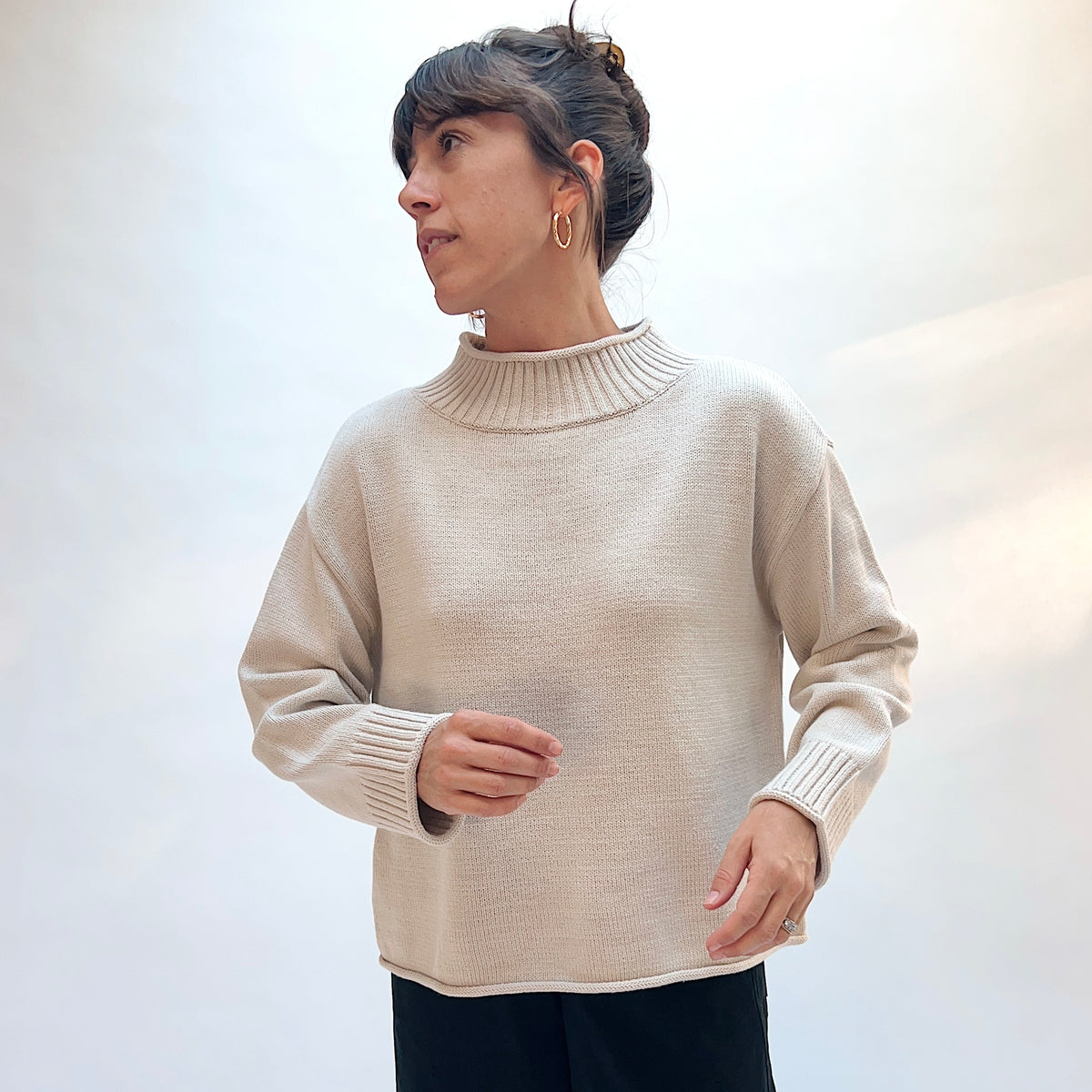 Habitat Fireside Cabin Sweater in Dove, front three-quarter view showing the relaxed boxy fit and rolled hem in dove gray
