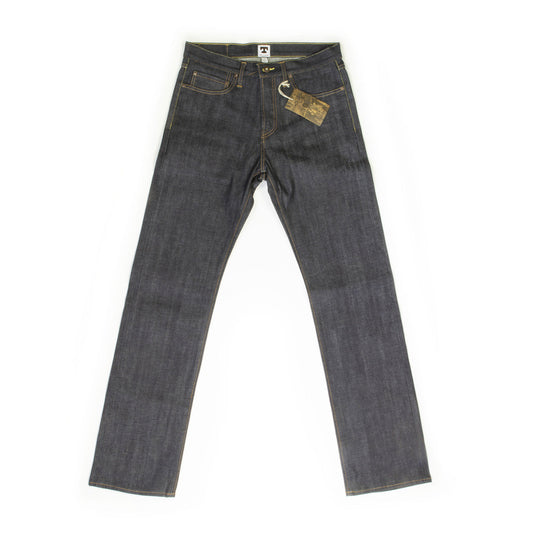 Front view of the Tellason Ankara Straight Leg Selvedge Denim Jeans in raw indigo, laid flat on white background, showing true straight leg fit, button fly, two front slash pockets, coin pocket, and leather hang tag with gold topstitching throughout
