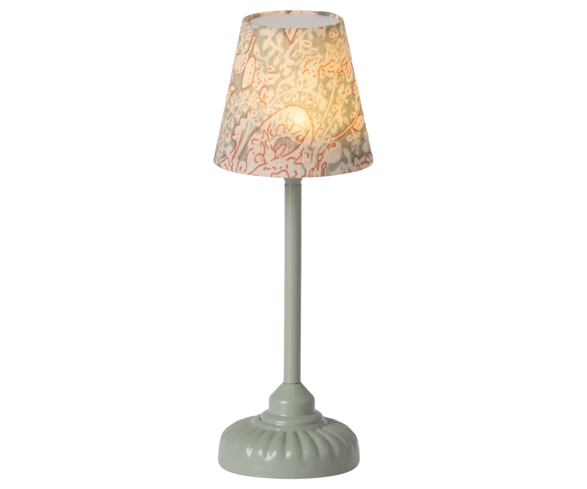 Maileg Vintage Floor Lamp in Mint — miniature metal floor lamp with a mint green base and stem, topped with a floral cotton shade in blush and sage, shown illuminated against a white background
