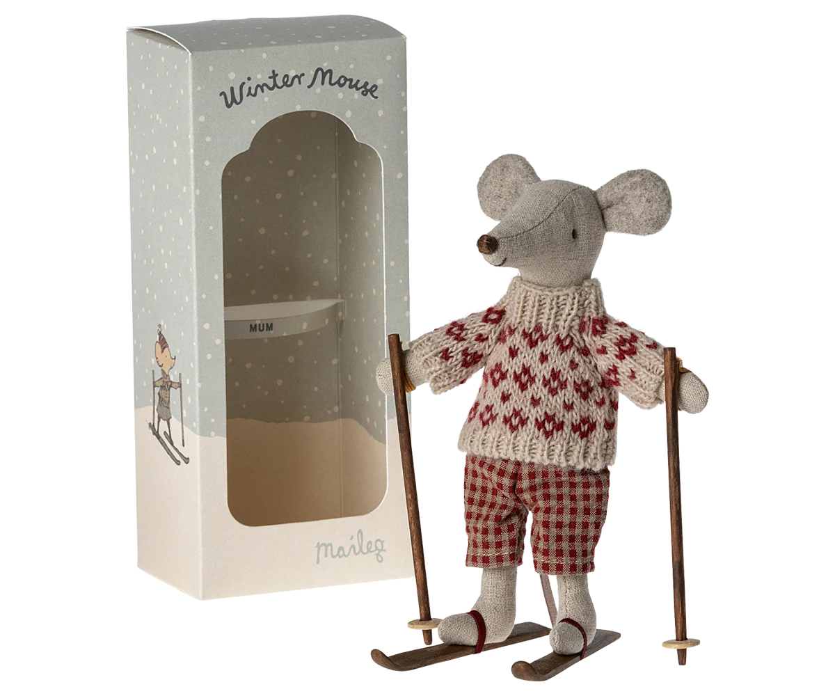 Maileg Winter Mouse Ski Mum — linen mouse doll in a red Fair Isle knit sweater and red gingham pants, standing on wooden skis with poles, shown next to its Maileg gift box
