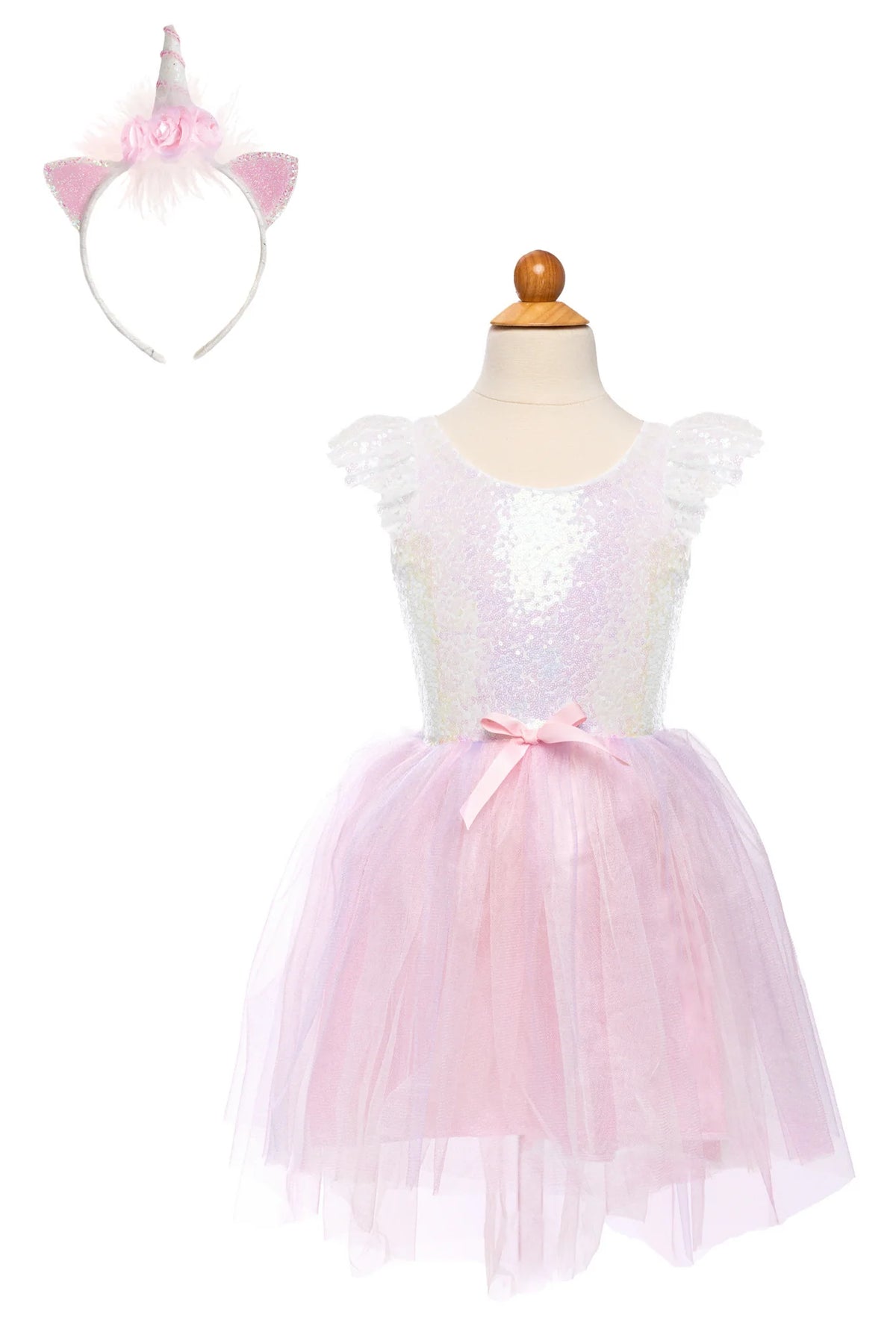 Great Pretenders Dreamy Unicorn Dress and Headband set on a dress form, showing the iridescent white sequin bodice with flutter sleeves, pink satin bow at the waist, layered pink tulle skirt, and unicorn horn headband with pink fluffy ears, on a white background
