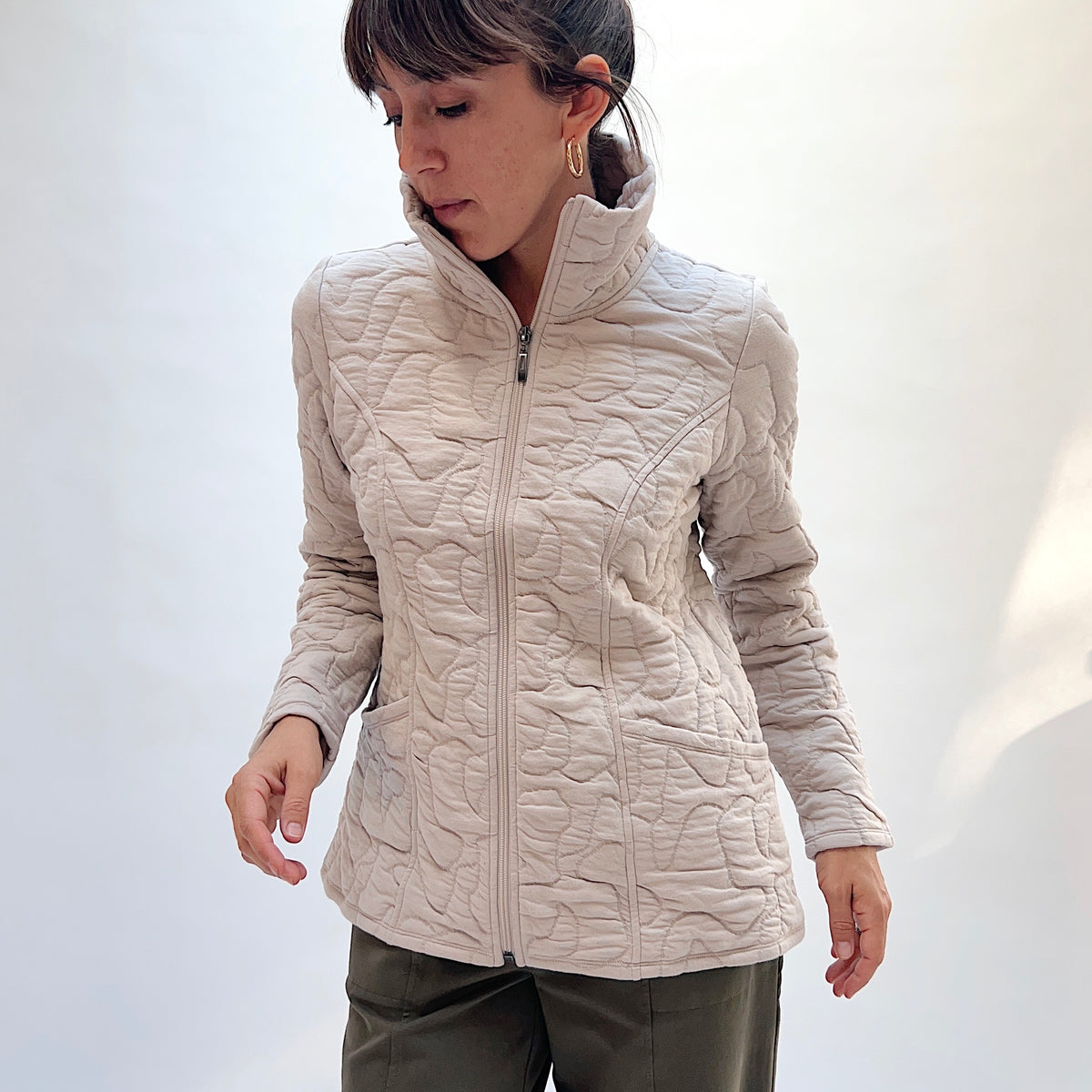 Habitat Cascade Quilted Coat in Dove, front view showing the zip-front closure, stand collar, fitted waist, and front pockets
