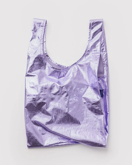 BAGGU Standard Baggu in Metallic Lavender, shiny lavender reusable shopping bag with two long handles, shown unfolded.
