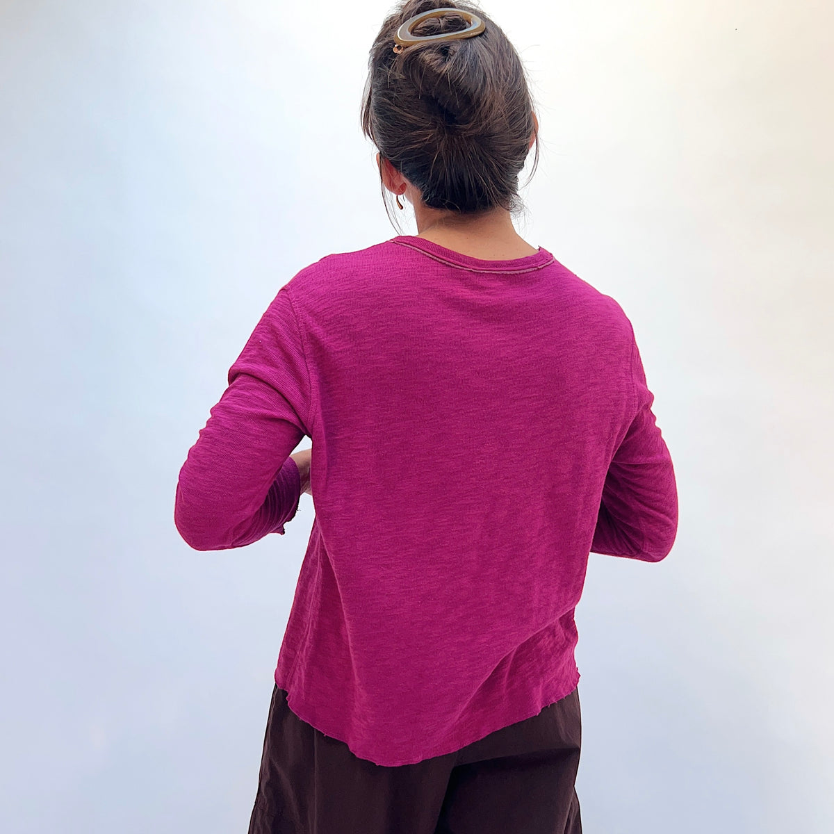 North Star Base Double Cotton Tee in Beet, back view showing the raw-edge neckline and straight hem in beet pink
