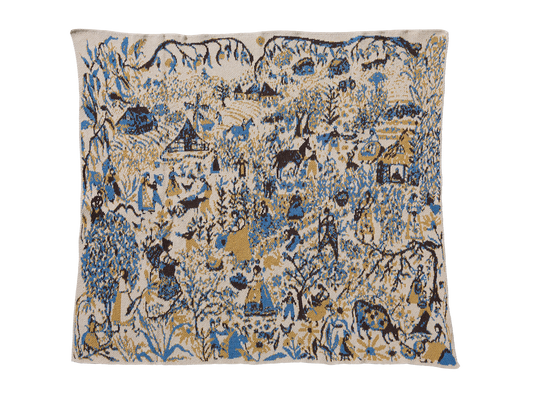 Farmscape Straw child blanket laid flat, with people, animals, houses, and trees in blue, yellow, and brown on cream.
