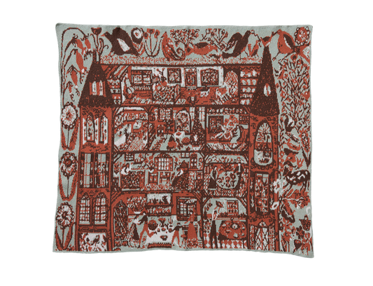 Swedish Farmhouse Sky Green child blanket laid flat, showing red and brown farmhouse rooms, birds, and flowers on pale green.
