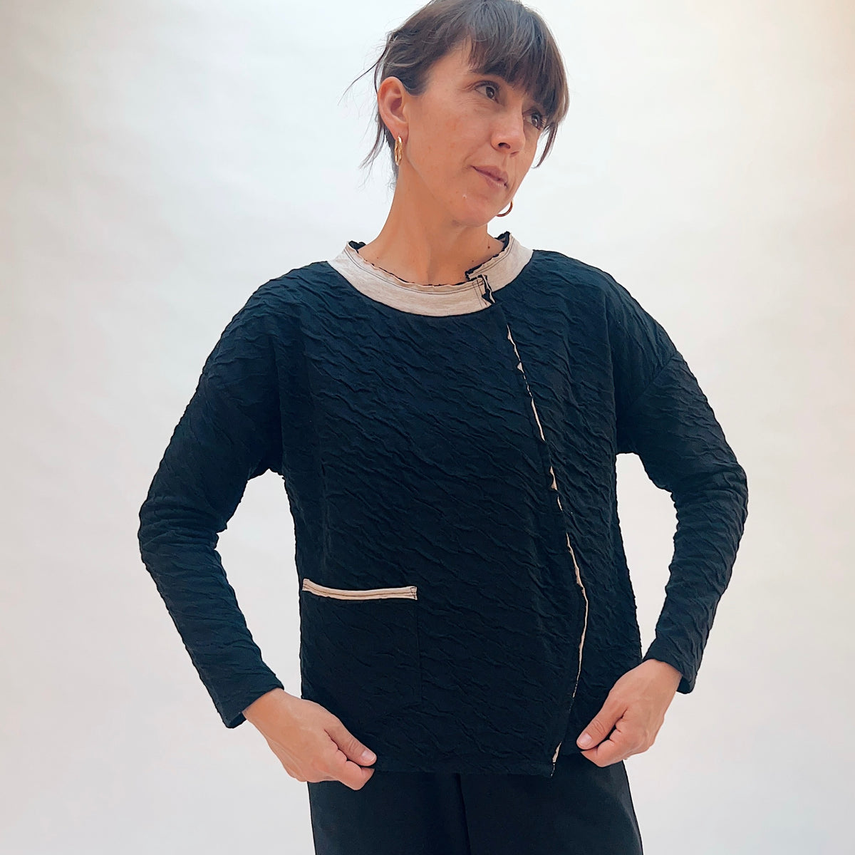 Habitat Crinkled Double Face Metro Pullover in Black, front view showing the crinkled double face texture and contrast crew collar with lettuce edge trim
