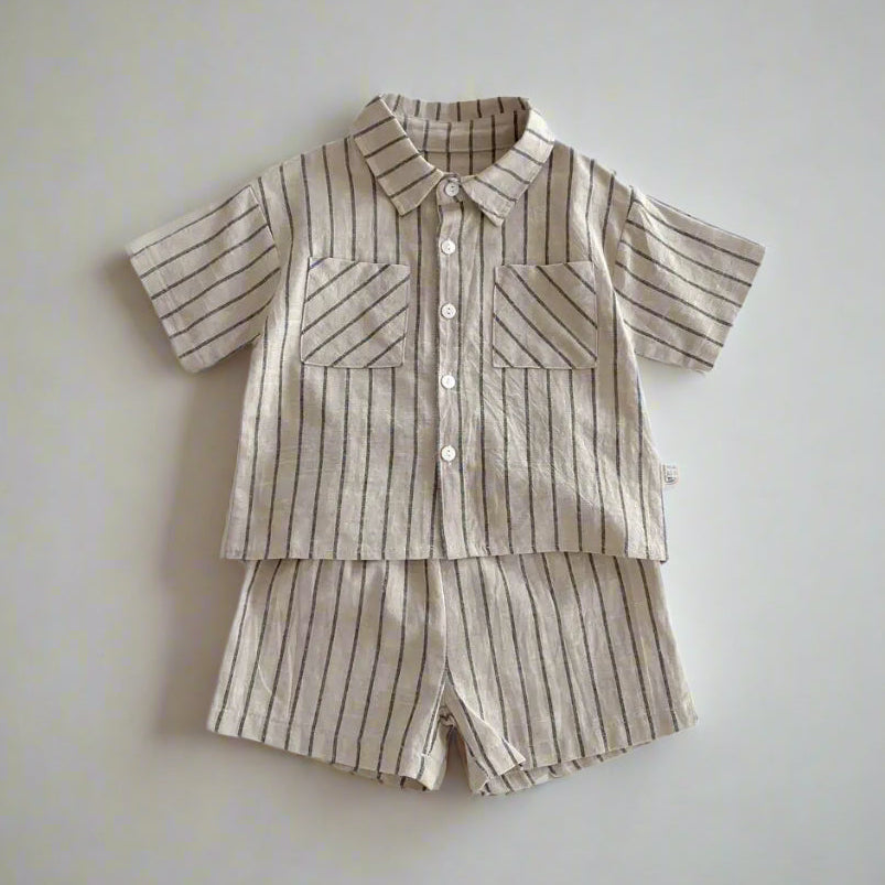 Striped children's shirt and shorts set on a light background