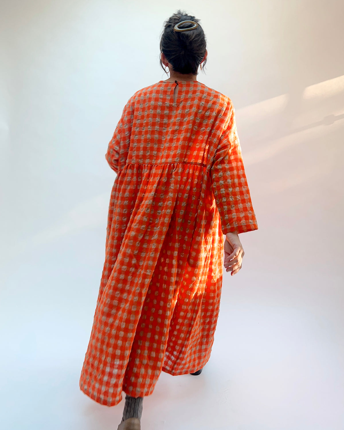Ichi Antiquités Gingham Wool Check Dress in Beige & Orange, back view showing the voluminous full skirt and long sleeves in orange and beige gingham
