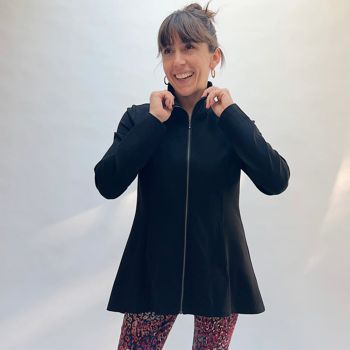 Habitat Luxe Ponte Soho Jacket in Black, front three-quarter view showing the zip-front and stand collar worn up on the black ponte fabric
