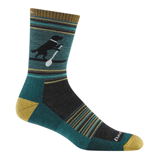 Darn Tough teal micro crew sock with a black dog holding a white paddle, striped accents, and mustard-yellow heel and toe.
