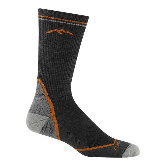 Darn Tough charcoal boot-height hiking sock with an orange mountain motif, orange accent lines, and gray heel and toe panels.
