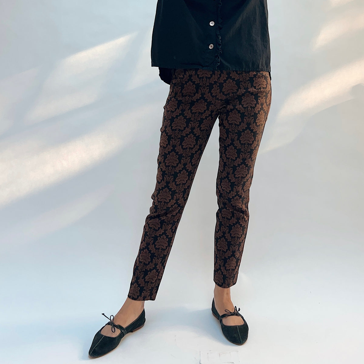 Lisette Chocolate Brocade Cigarette Pant, front close-up view showing the chocolate and black damask brocade pattern and slim ankle fit
