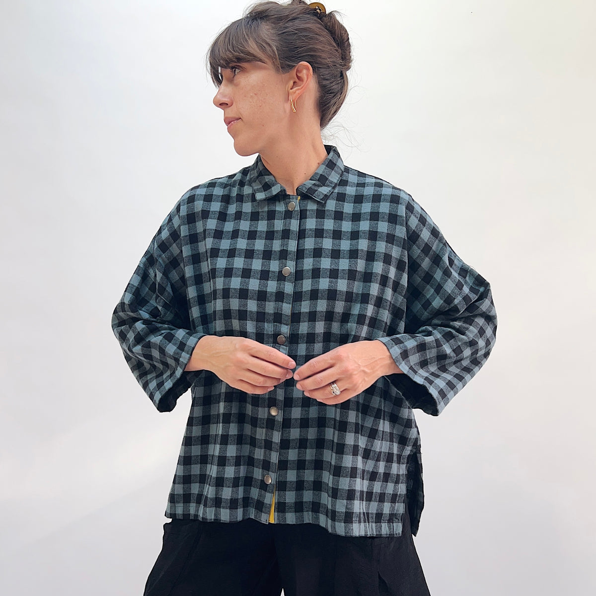 Eleven Stitch Big Check Big Shirt in Dusty Denim, front view showing the boxy oversized silhouette in dusty blue and black gingham check flannel with point collar and mustard contrast placket
