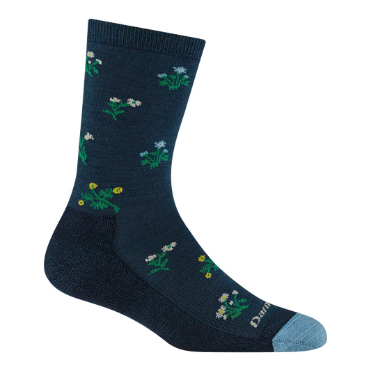 A single dark navy crew sock with a pattern of small white, blue, and yellow wildflowers, featuring a light blue toe cap and the Damier brand name printed near the toe.