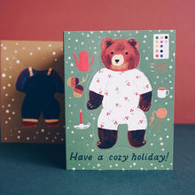 Load image into Gallery viewer, Card with a bear illustration and &#39;Have a cozy holiday!&#39; text on a green background.
