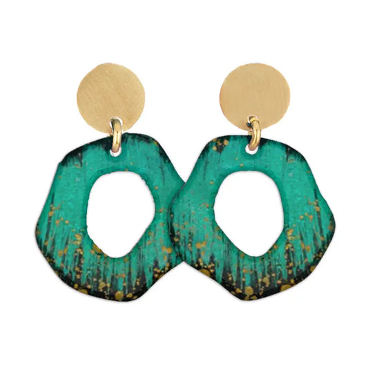 Pair of Sibilia Mancha Earrings in Forest, featuring matte gold round disc studs with large open-circle irregular drop pendants in deep forest green and black with gold speckle patina, on a white background
