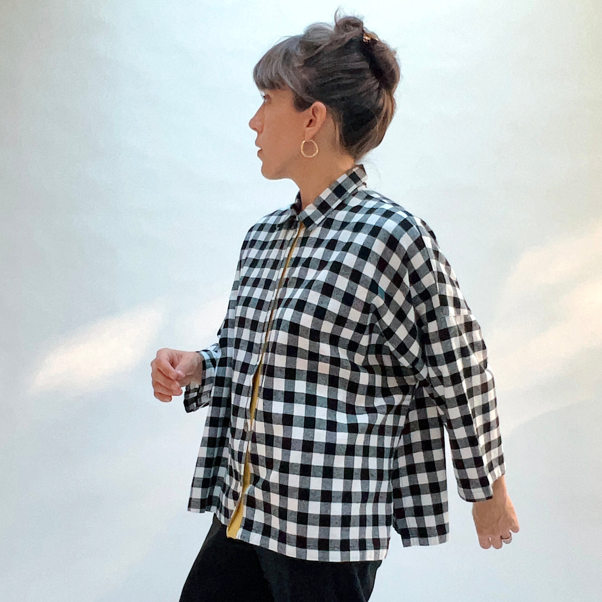 Eleven Stitch Big Check Big Shirt in Black & White, side view showing the boxy oversized fit and 3/4-length sleeves in large black and white gingham check cotton flannel
