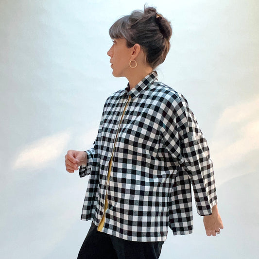 Eleven Stitch Big Check Big Shirt in Black & White, side view showing the boxy oversized fit and 3/4-length sleeves in large black and white gingham check cotton flannel
