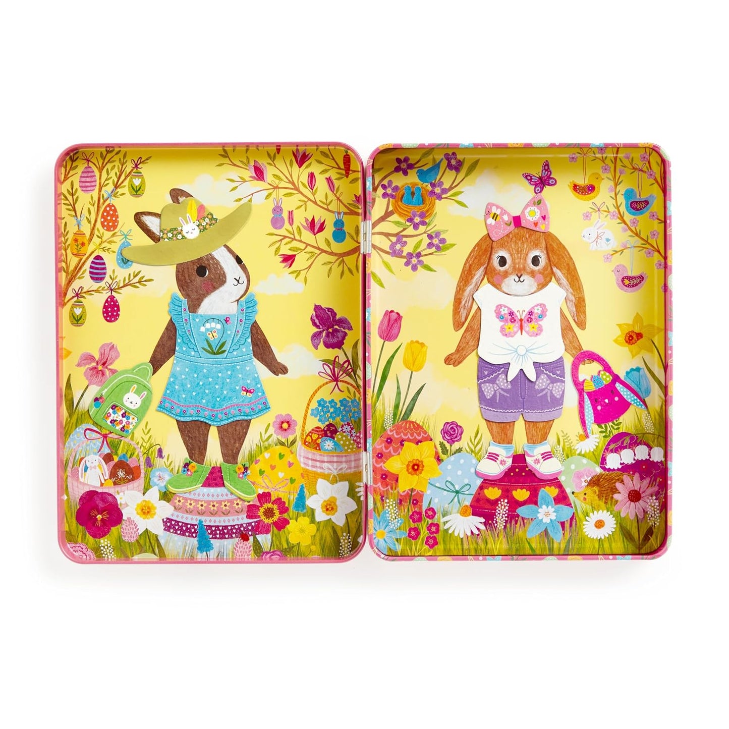 Open hinged tin box showing two illustrated bunny characters dressed in colorful outfits on a yellow floral background, ready for magnetic dress-up play