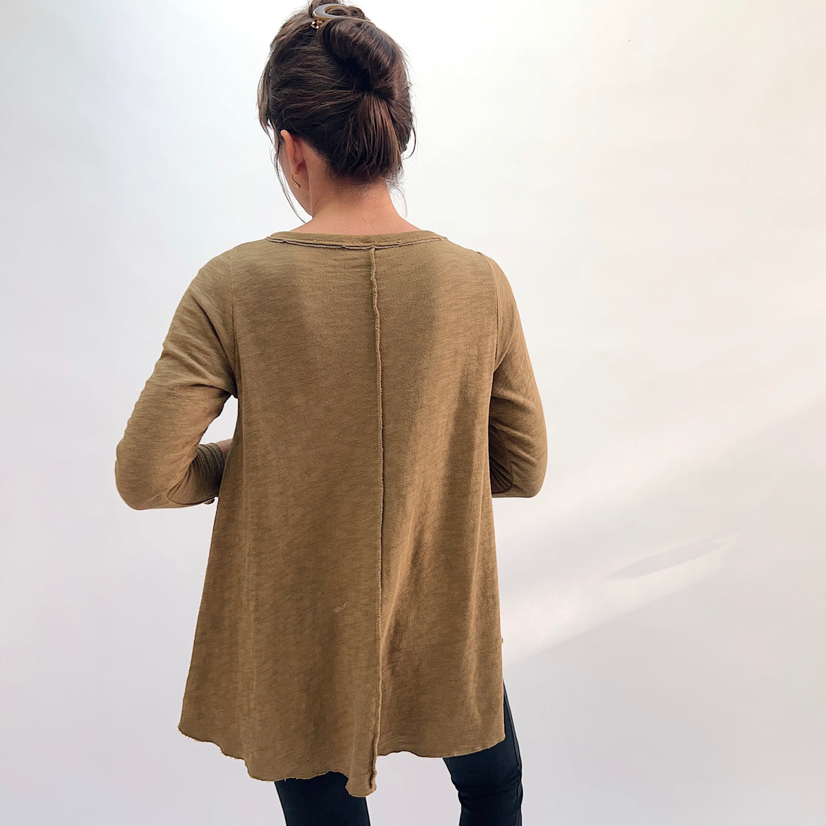North Star Base Shorter High Low Double Cotton Tee in Olive, back view showing the center back seam, raw-edge neckline finish, and longer high-low hem in olive
