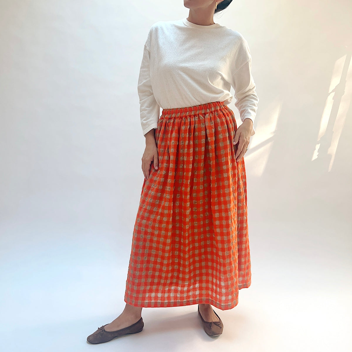 Ichi Antiquités Gingham Wool Check Skirt in Beige & Orange, front view showing the gathered waistband and long hem.
