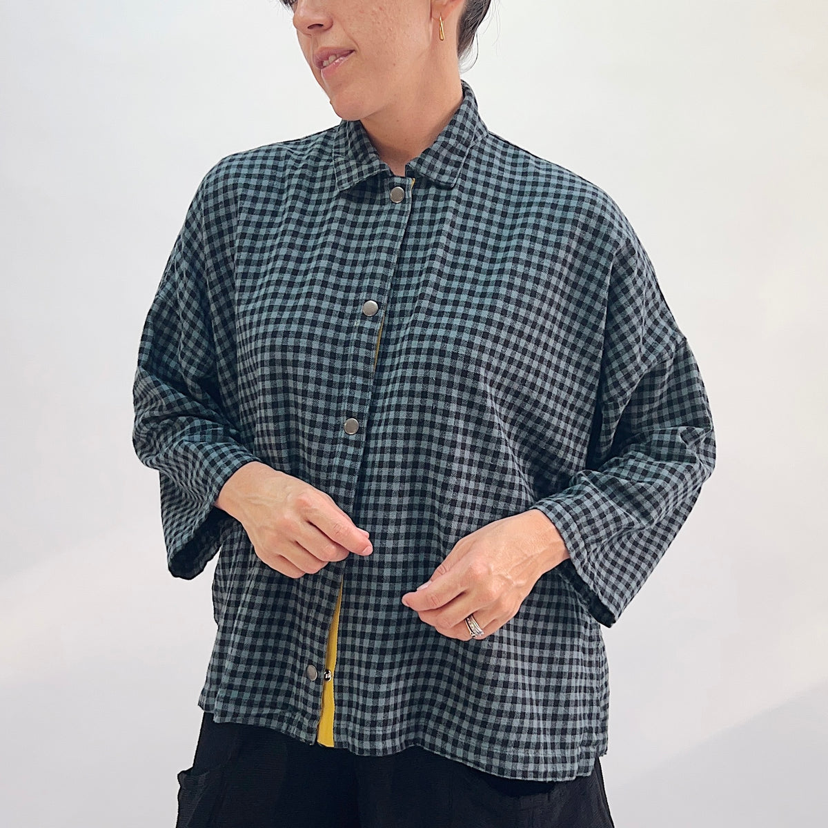 Eleven Stitch Small Check Big Shirt in Dusty Denim, close front view showing the button-front with mustard contrast placket detail in dusty teal and black small gingham check cotton flannel
