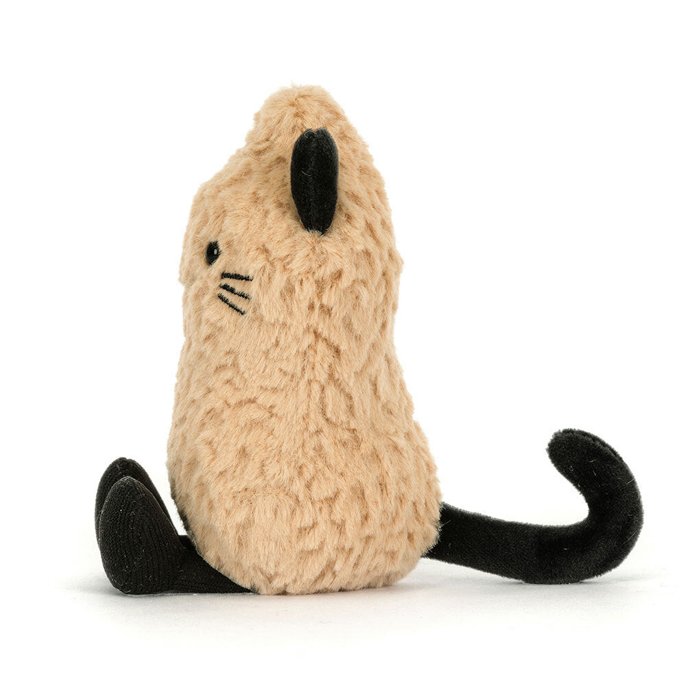 Side profile of the Jellycat Amuseables Peanut Cat plush toy on a white background, showing its peanut-shaped golden body, black nose, embroidered whiskers, and curled black tail