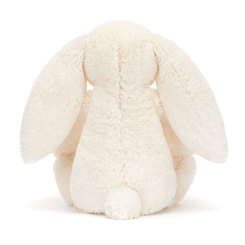 Jellycat Blossom Cream Bunny 'Berry' Original — rear view showing the cream textured fur, wide floppy ears, and small white cotton tail, on a white background
