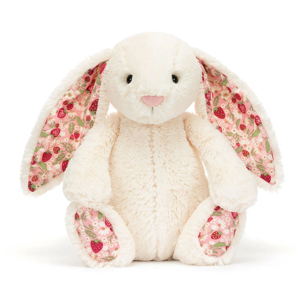 Jellycat Blossom Cream Bunny 'Berry' Original — front view of the larger original size, showing the cream plush body, long floppy ears with pink strawberry floral lining, pink embroidered nose, black hard eyes, and strawberry print paw pads, on a white background