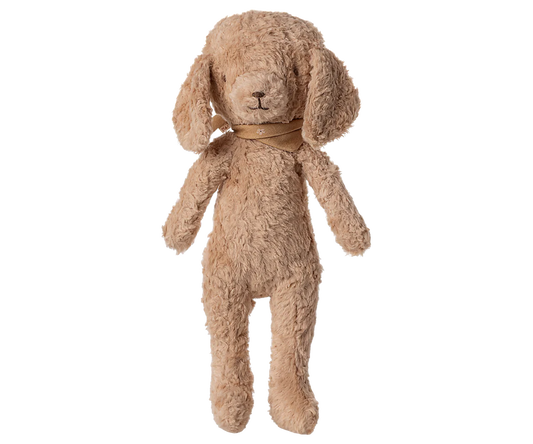 Maileg Poodle Dog in Dusty Powder on a white background — a soft curly-textured cotton and viscose stuffed poodle in warm dusty powder with floppy ears, embroidered nose, and a tonal satin ribbon at the neck
