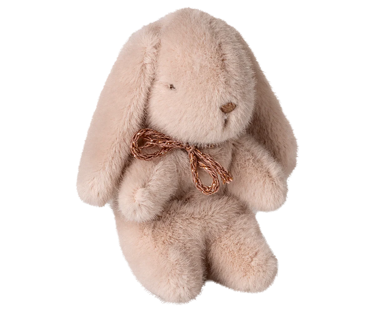 Plush bunny toy with a gold bow on a white background