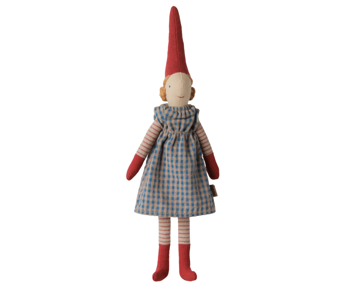 Maileg Pixy Girl, size 1, in a blue checkered dress, striped sleeves and legs, red mittens and socks, and a tall red hat.
