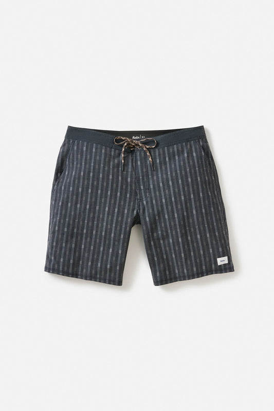 Katin Crossroads Hybrid Trunk in Black Wash laid flat on a light grey background, showing the dark charcoal vertical stripe print, braided drawstring waistband with rubber aglets, and small white Katin label on the lower right leg
