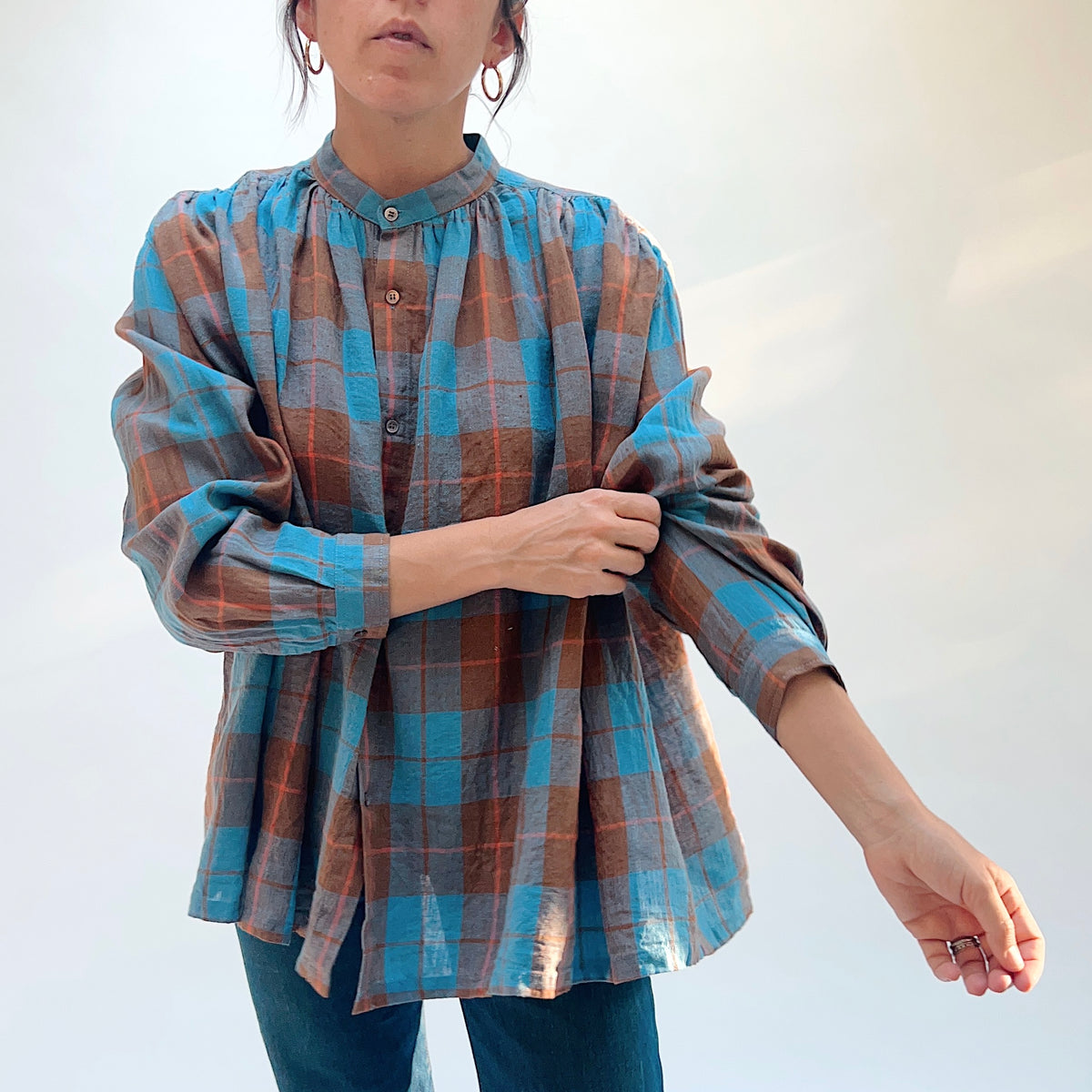 Ichi Antiquités Woven Plaid Check Shirt in Blue, front view with model adjusting a sleeve.
