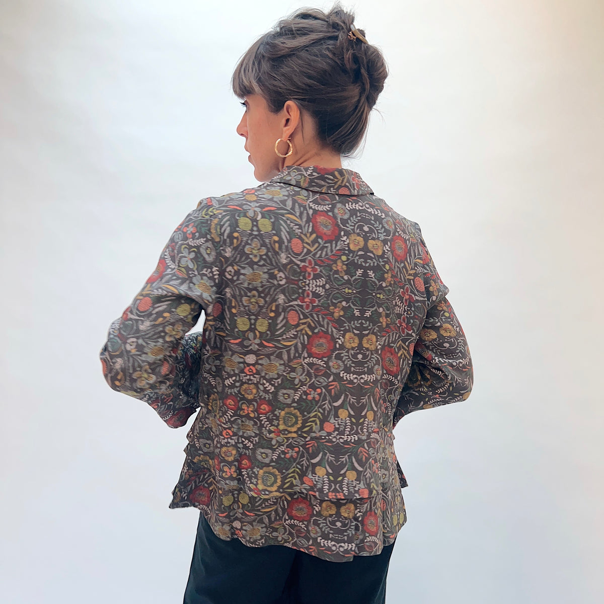 Habitat Crepe Garden Flounce Shirt in Olive, back view showing the double-layer flounced hem and dense garden floral print
