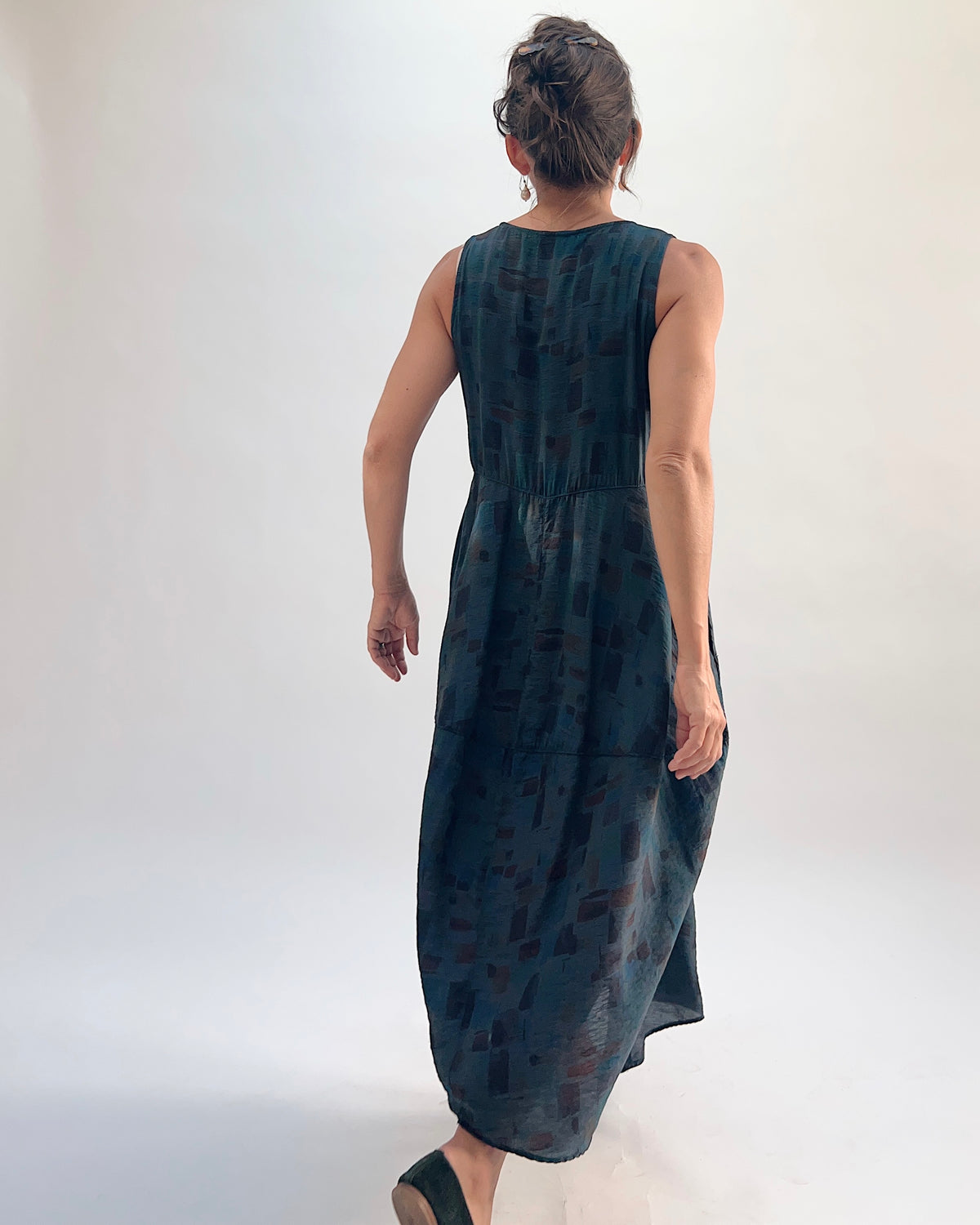 Back view of the Cut Loose Sea Glass Seamed Parachute Bubble Dress in Etan in deep teal semi-sheer viscose-nylon with abstract brushstroke block print and cocooning bubble skirt silhouette
