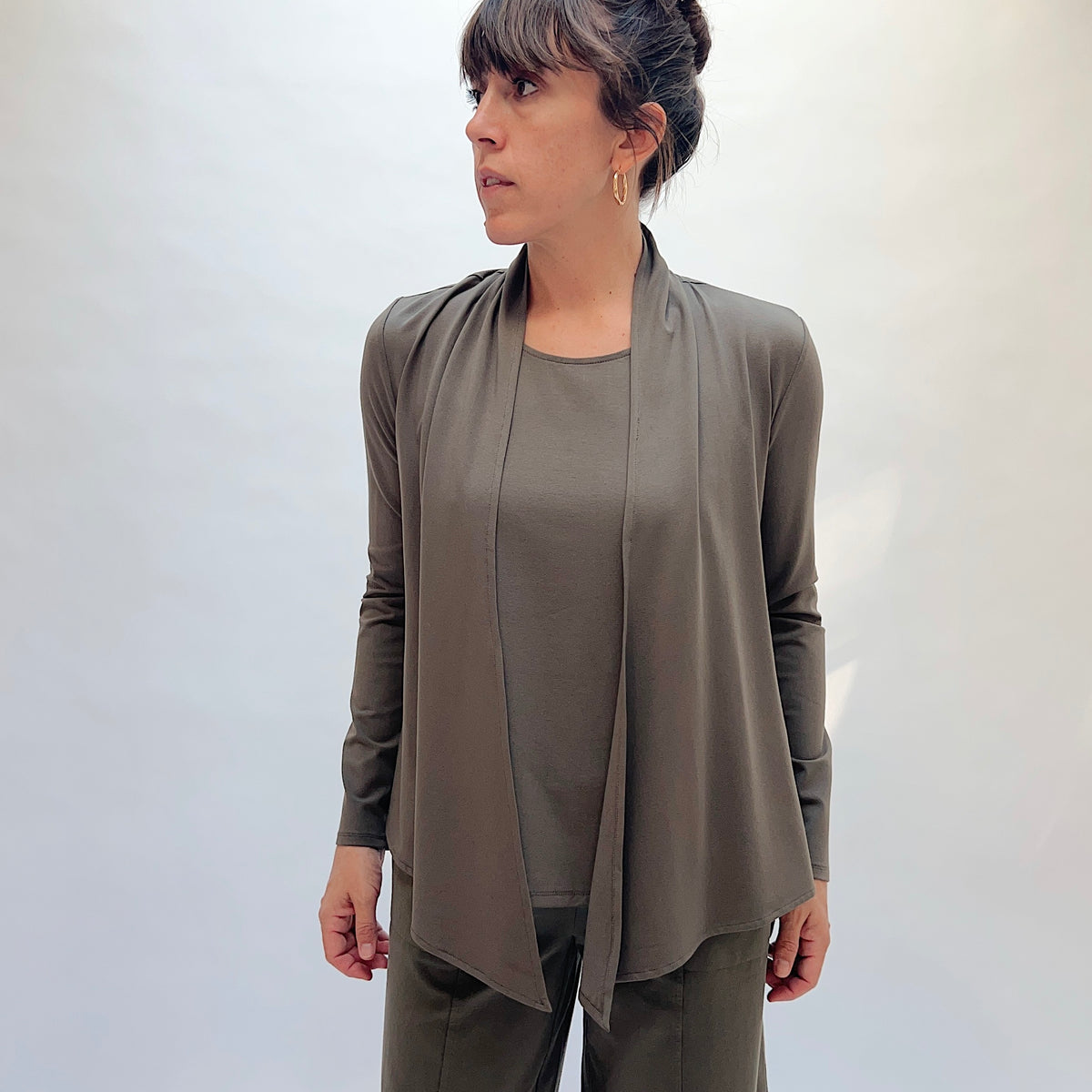 Habitat Core Travel Waterfall Jacket in Umber, front view showing the draped waterfall lapel and open-front silhouette
